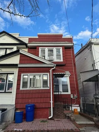 Buy this 3 bed house on 87-11 80th Street in New York, NY 11421