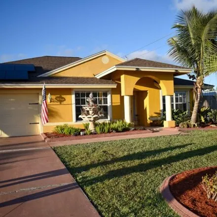 Buy this 4 bed house on 1705 Southwest Desert Avenue in Port Saint Lucie, FL 34953