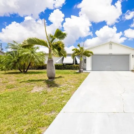 Buy this 3 bed house on 1275 Southwest Asturia Avenue in Port Saint Lucie, FL 34953