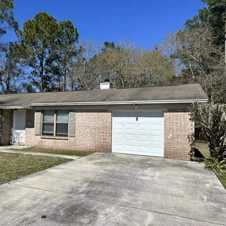 Rent this 3 bed house on 7696 Gregory Drive in Jacksonville, FL 32210