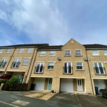 Rent this 4 bed townhouse on Oberon Way in Cottingley, BD16 1WH