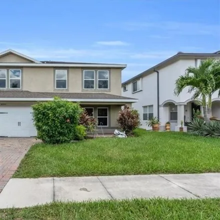 Buy this 5 bed house on 10377 Canal Brook Lane in Lehigh Acres, FL 33936
