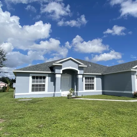 Buy this 4 bed house on 1125 Southwest Bellevue Avenue in Port Saint Lucie, FL 34953