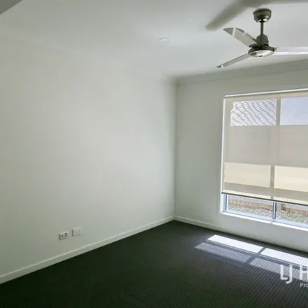 Rent this 4 bed apartment on Lambent Street in Yarrabilba QLD, Australia