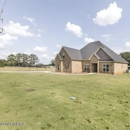 Buy this 4 bed house on 1069 John E. Sullivan Road in Byron, Peach County