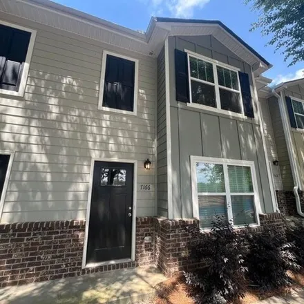 Rent this 3 bed townhouse on 7124 Gotland Street in Fulton County, GA 30291