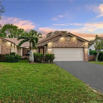 Buy this 4 bed house on 11464 Northwest 1st Place in Coral Springs, FL 33071