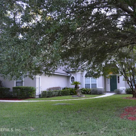 Rent this 4 bed house on 4093 Lonicera Loop in Fruit Cove, FL 32259