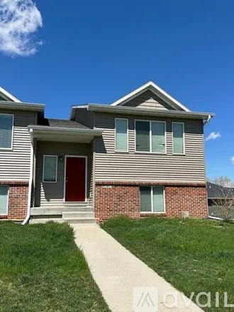 Rent this 4 bed townhouse on 3707 Marigold Drive