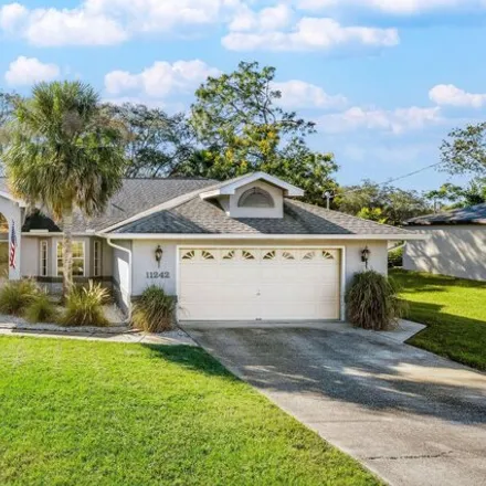 Buy this 3 bed house on 11246 Riddle Drive in Spring Hill, FL 34609
