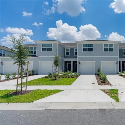 Rent this 3 bed townhouse on Sparkling Shell Avenue in Osceola County, FL 34746