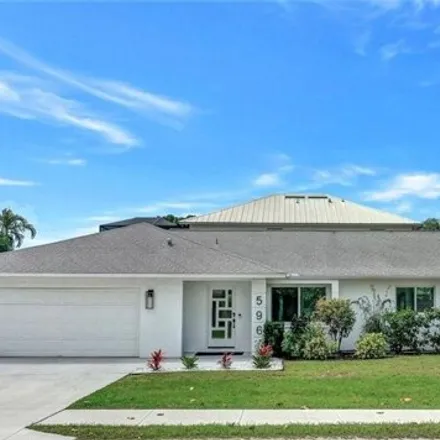 Buy this 4 bed house on 596 105th Ave N in Naples, Florida