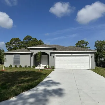 Rent this 4 bed house on 180 Hilton Avenue Northwest in Palm Bay, FL 32907