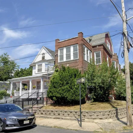 Buy this 8 bed duplex on SUmmit Avenue at Belmont Avenue in Clifton Place, Jersey City