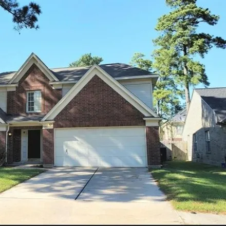 Rent this 4 bed house on 8952 Village Hills Drive in Harris County, TX 77379