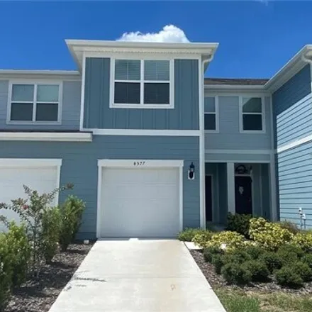 Rent this 3 bed house on 4577 Sparkling Shell Ave in Kissimmee, Florida