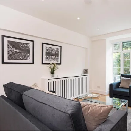 Rent this studio loft on Grove End Gardens in Camden, London