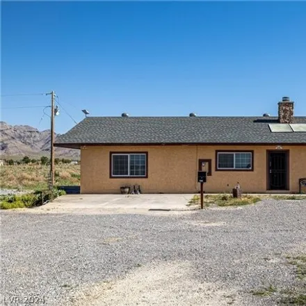 Buy this 3 bed house on 1450 West Simkins Road in Pahrump, NV 89060