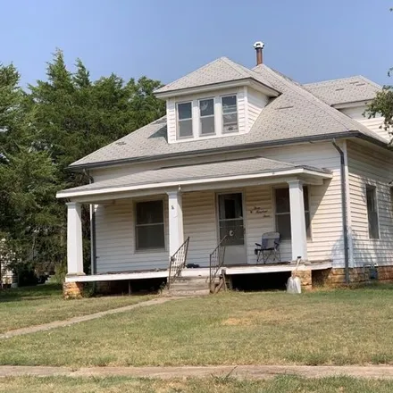 Buy this 4 bed house on 353 East School Street in Lincoln Center, KS 67455