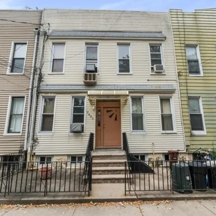 Buy this 8 bed house on 74-51 64th Place in New York, NY 11385