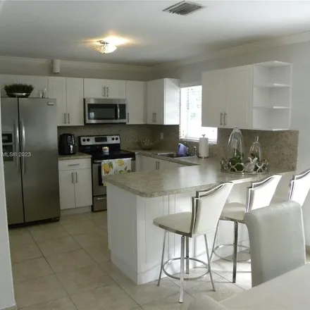 Rent this 3 bed apartment on 3466 Southwest 23rd Street in Silver Bluff Estates, Miami
