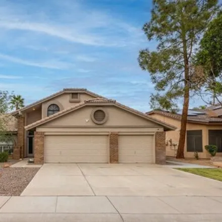 Buy this 4 bed house on 7032 West Wescott Drive in Glendale, AZ 85308