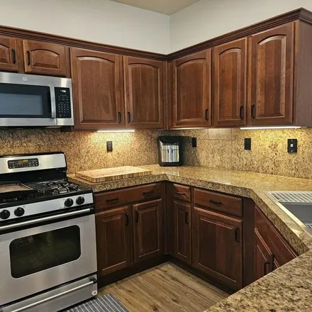 Rent this 4 bed apartment on 3811 West Adamanda Court in Phoenix, AZ 85086