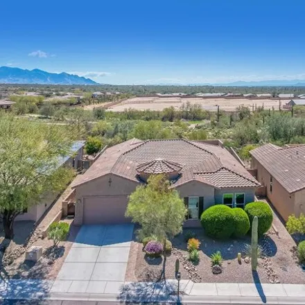 Buy this 4 bed house on 6595 West Whispering Windmill Lane in Marana, AZ 85658