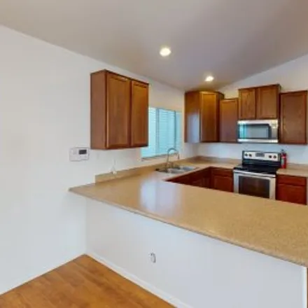 Rent this 4 bed apartment on 1815 South 217Th Avenue in Sundance, Buckeye