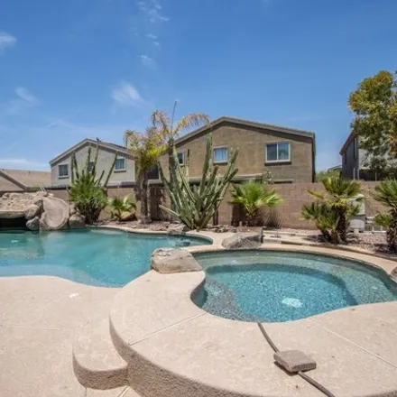 Buy this 5 bed house on 35936 West Cartegna Lane in Maricopa, AZ 85138