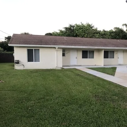Rent this 3 bed house on 4871 Orlando Avenue in Military Park, Palm Beach County