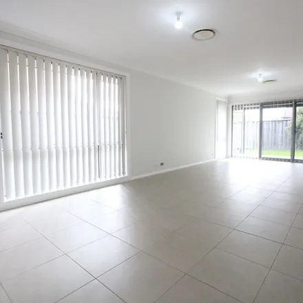Rent this 3 bed apartment on Glider Avenue in Middleton Grange NSW 2171, Australia