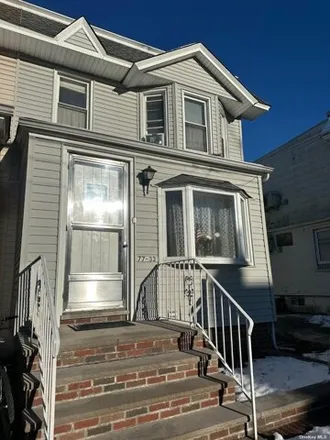 Buy this 3 bed house on 77-33 76th Street in New York, NY 11385