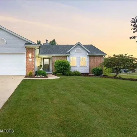 Buy this 4 bed house on 7457 Player's Club Drive in Delta Charter Township, MI 48917