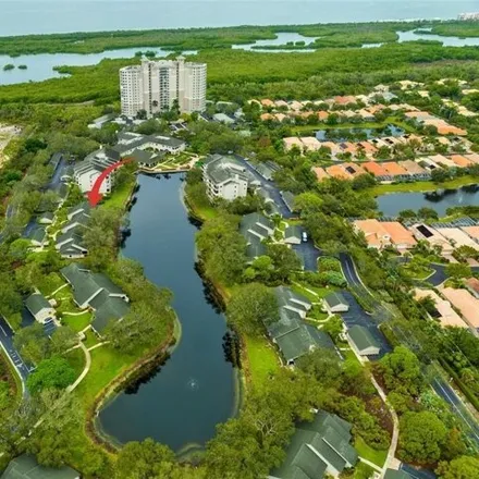 Buy this 2 bed condo on Arbor Lake Drive in Collier County, FL 34110