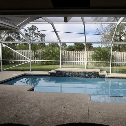 Buy this 4 bed house on 1643 Southwest Escobar Lane in Port Saint Lucie, FL 34953