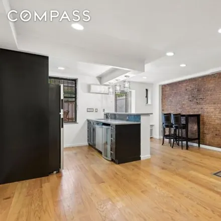 Rent this 2 bed townhouse on 153 East 117th Street in New York, NY 10035