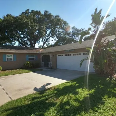 Rent this 4 bed house on 8499 South Flintrock Court in Holiday Village, Hillsborough County