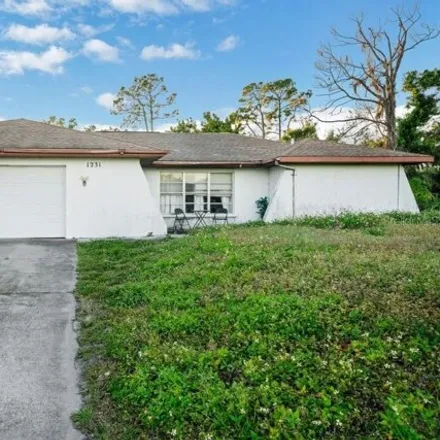 Buy this 3 bed house on 1233 Beacon Drive in Port Charlotte, FL 33952