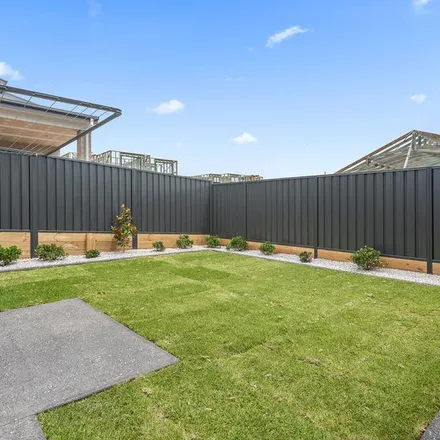 Rent this 3 bed townhouse on Saturn Crescent in Dunmore NSW 2529, Australia