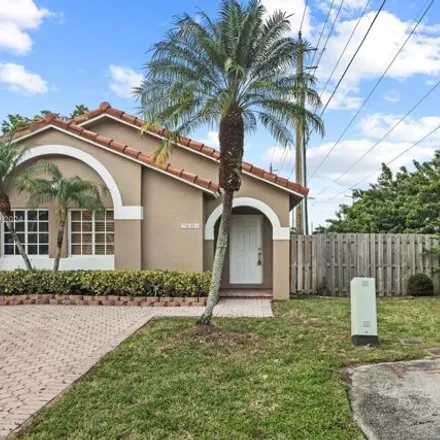 Rent this 3 bed house on 7601 Northwest 166th Terrace in Palm Springs North, Hialeah