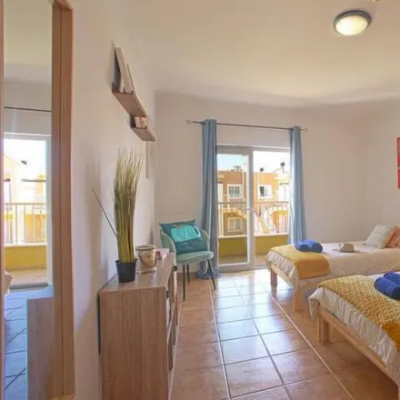 Rent this 3 bed townhouse on Alcantarilha e Pêra in Faro, Portugal