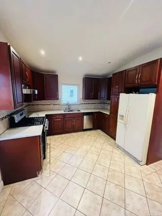 Rent this 3 bed house on 91-21 92nd Street in New York, NY 11421