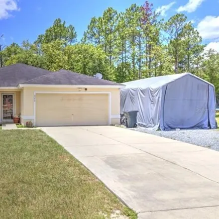 Buy this 4 bed house on 6358 Sw 155th Pl in Ocala, Florida