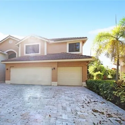 Rent this 4 bed house on 4699 Rothschild Drive in Hidden Hammocks Estates, Coral Springs