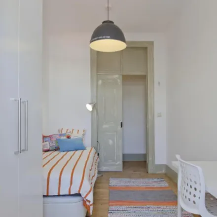 Rent this 7 bed room on Rua Álvaro Coutinho in 1150-010 Lisbon, Portugal