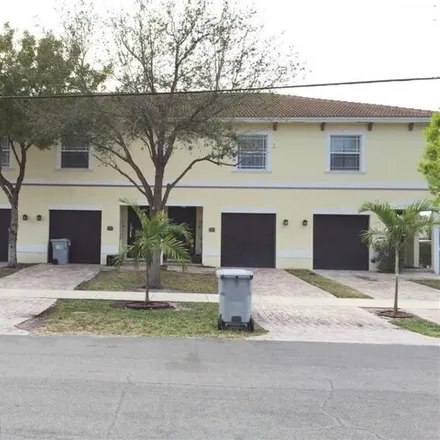 Buy this 12 bed townhouse on Northeast 23rd Avenue in Pinehurst Village, Pompano Beach