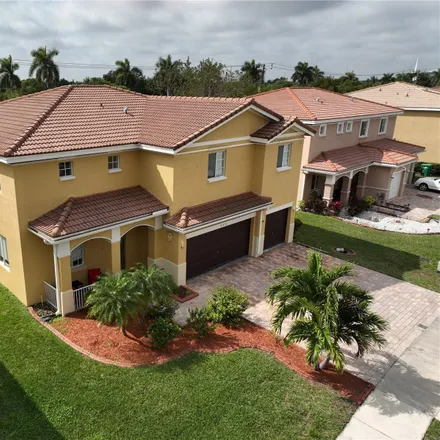 Rent this 6 bed house on 960 Northwest 204th Street in Andover Golf Estates, Miami Gardens