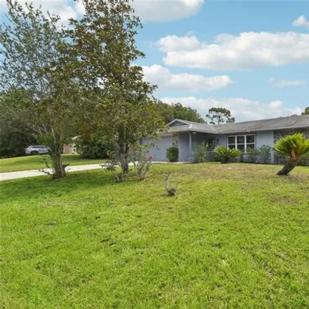Buy this 3 bed house on 3199 Urmey Avenue in Deltona, FL 32738
