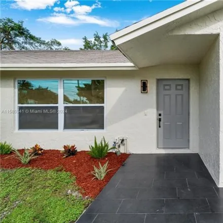 Buy this 4 bed house on 1310 Northeast 34th Street in Coral Woods, Oakland Park